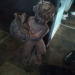 Cast bronze fountain boy holding a coie fish